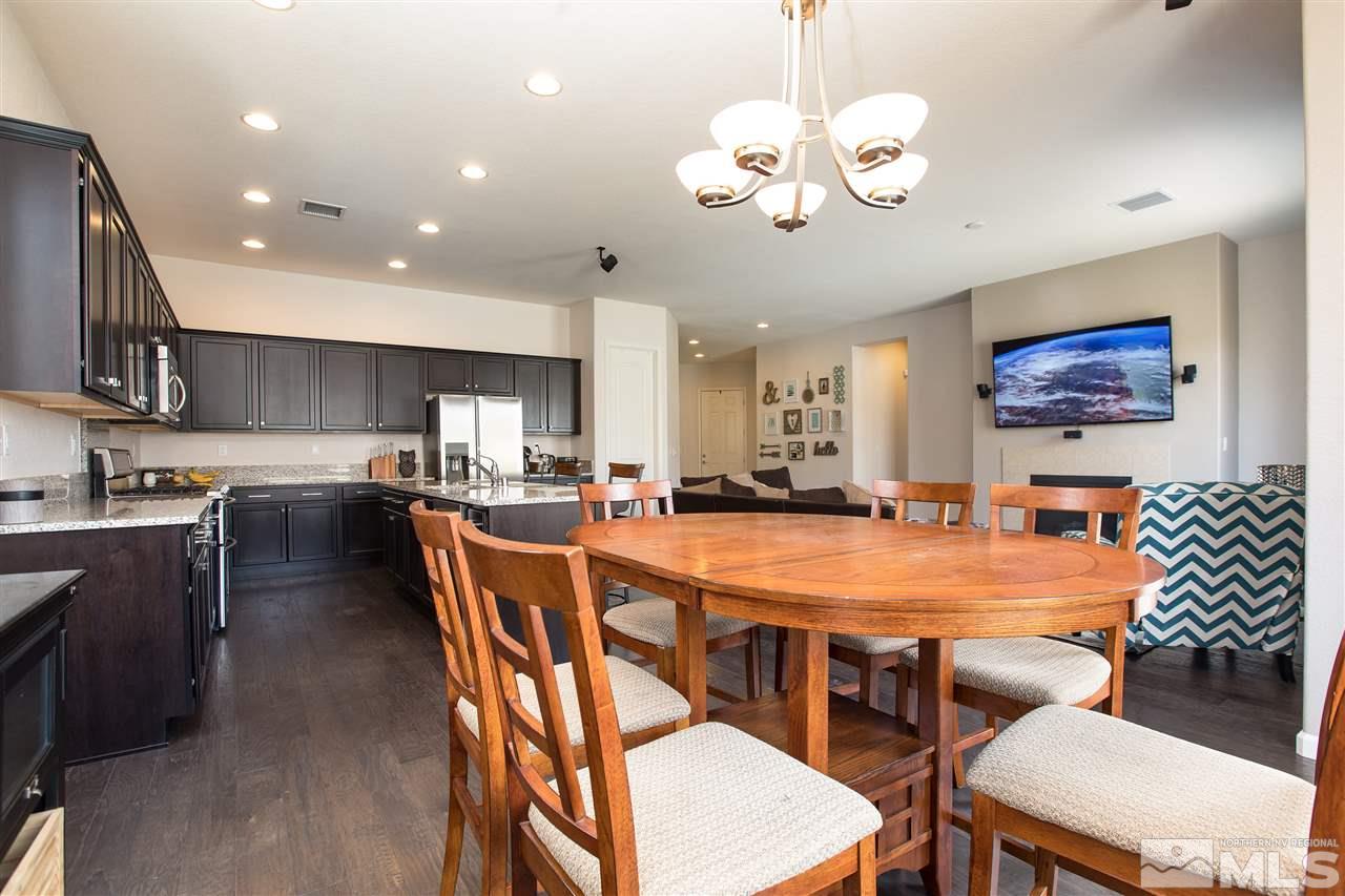 3045 Show Jumper Lane Reno, NV 89521 - Photo 5 of 22 a large kitchen with a table and chairs
