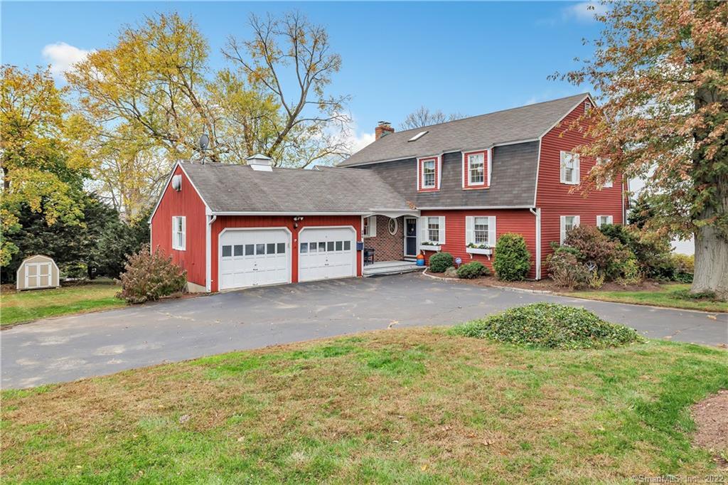 380 Hilltop Road Bridgeport, CT 06605 - Photo 1 of 1 a front view of a house with a yard and garage