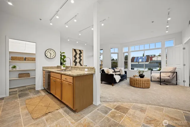 a kitchen with stainless steel appliances granite countertop a stove and a sink