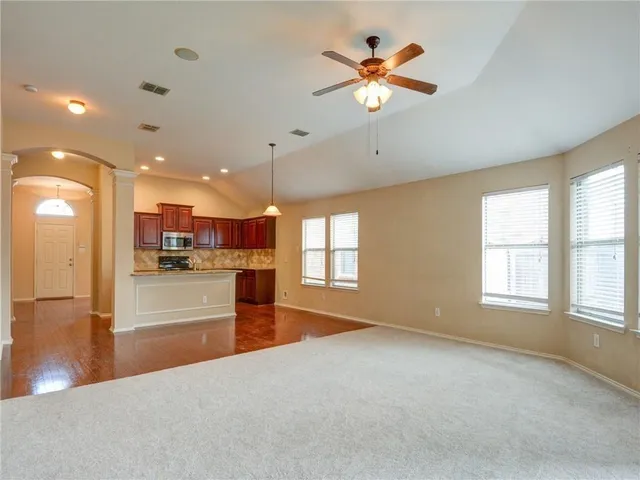 a view of an empty room with a window