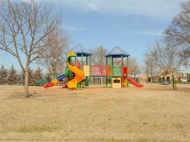 a view of outdoor space with playground and mountain view