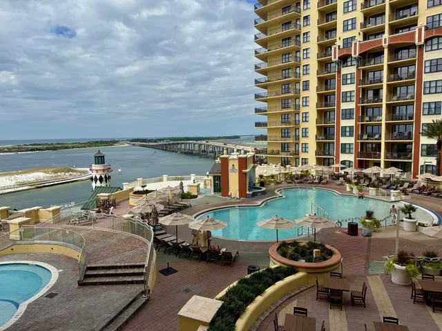 a bedroom with a bed couch and a window