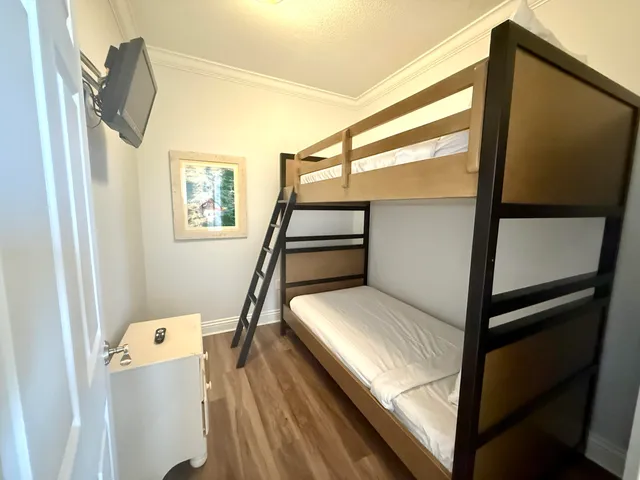 a spacious bathroom with a granite countertop sink mirror and bathtub