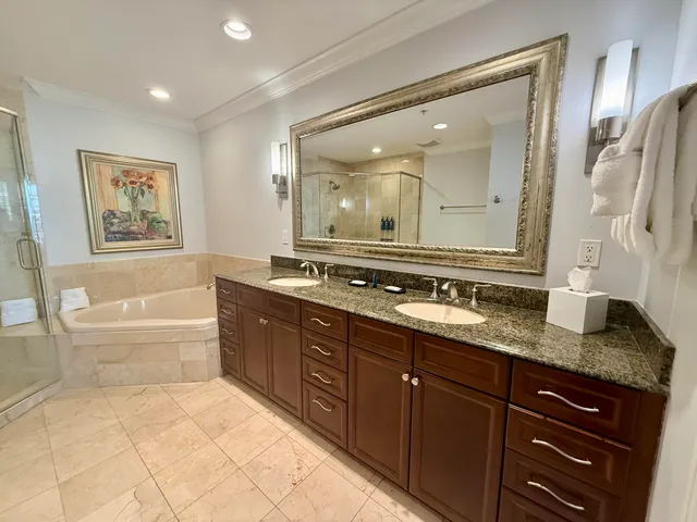 a roof deck with table and chairs