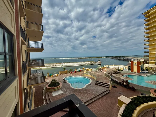 a view of a balcony with chairs
