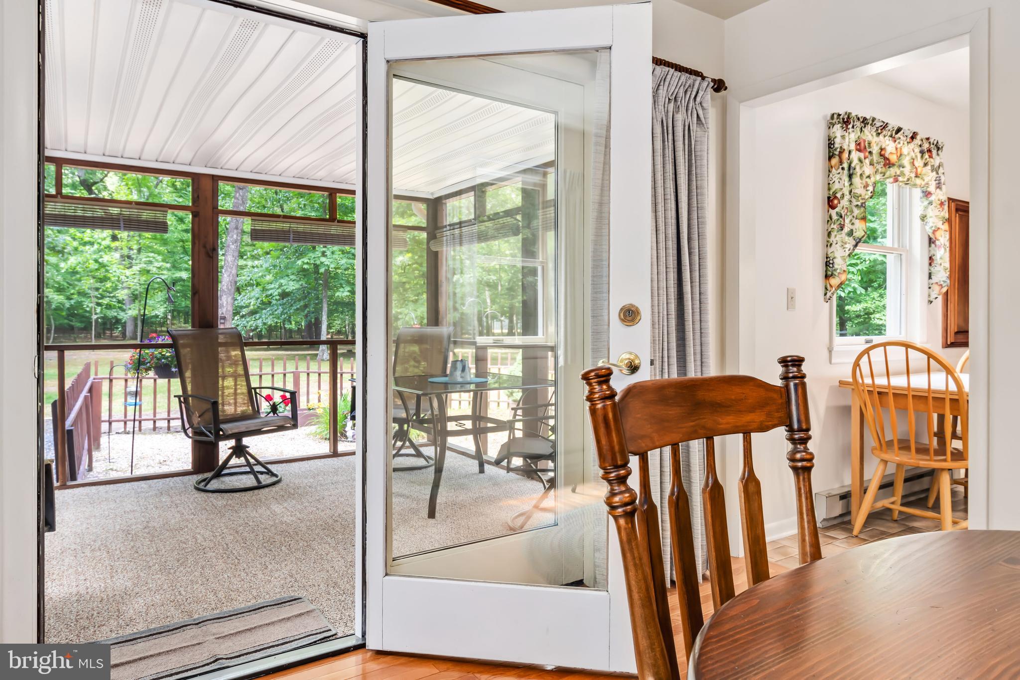 14700 Plains Court Ridgely, MD 21660 - Photo 14 of 53 From dining room entrance to screen porch