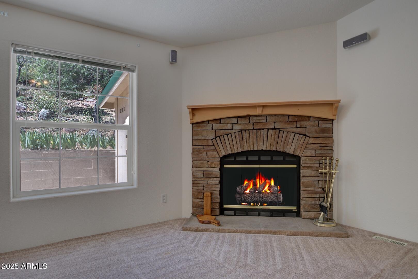 405 East Cherry Street Payson, AZ 85541 - Photo 12 of 47 a living room with a fireplace