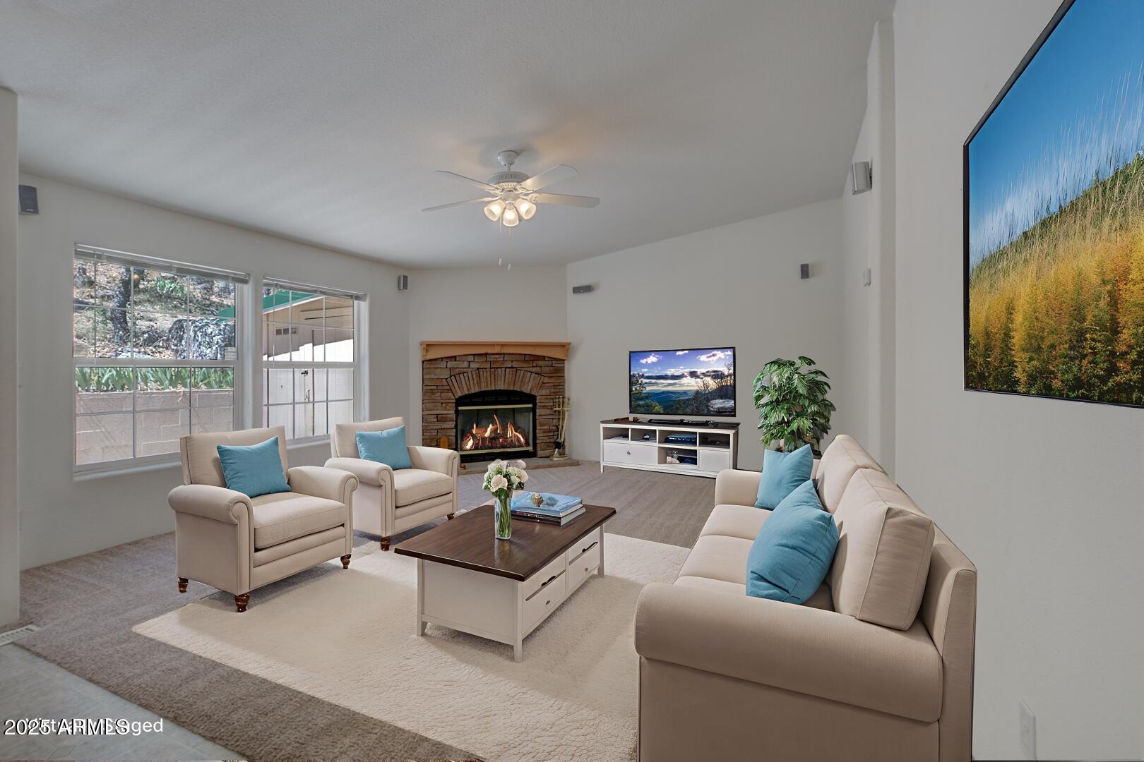 405 East Cherry Street Payson, AZ 85541 - Photo 14 of 47 a living room with furniture a fireplace and a flat screen tv