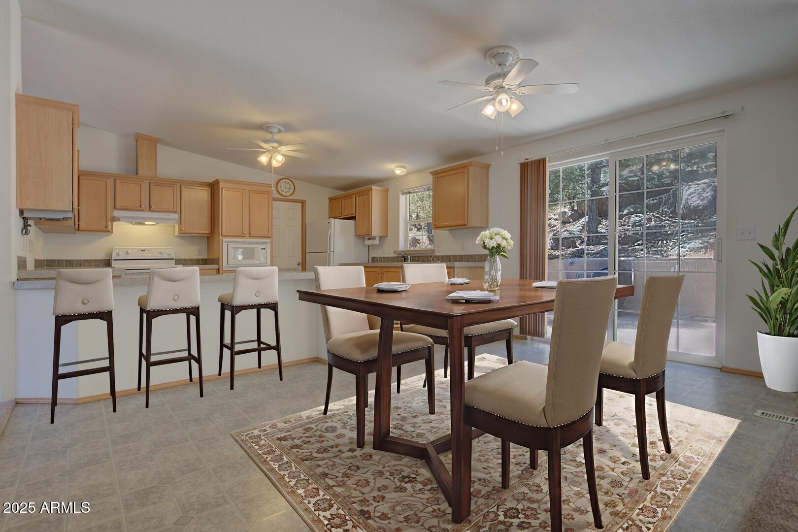 405 East Cherry Street Payson, AZ 85541 - Photo 18 of 47 a view of a dining room with furniture and a chandelier