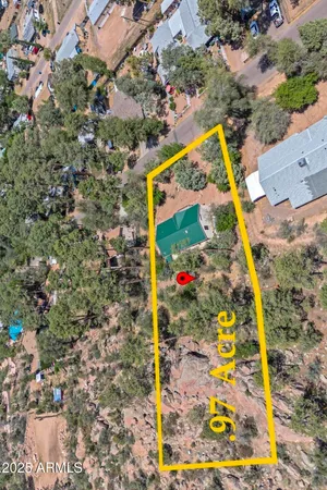 a view of a house with a snow in the background