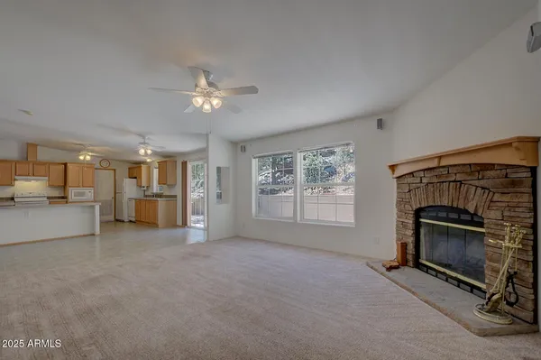 a spacious bedroom with a bed and a potted plant