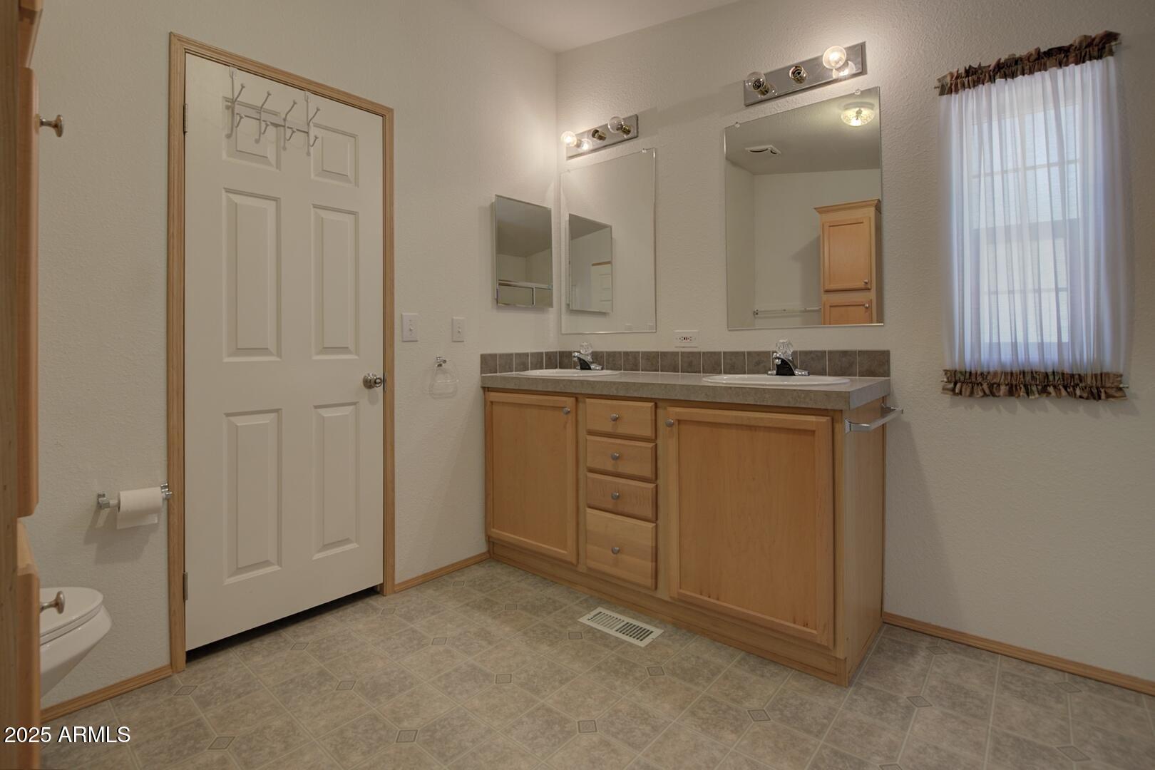 405 East Cherry Street Payson, AZ 85541 - Photo 24 of 47 a bathroom with a granite countertop sink and a mirror