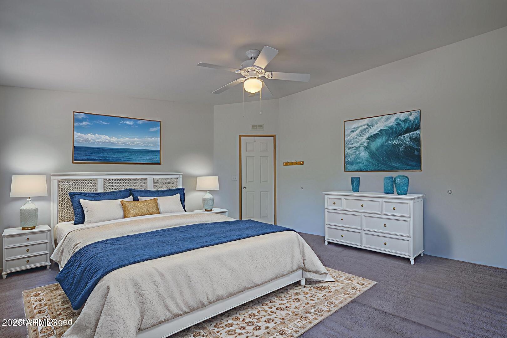 405 East Cherry Street Payson, AZ 85541 - Photo 25 of 47 a bedroom with a bed and a chandelier