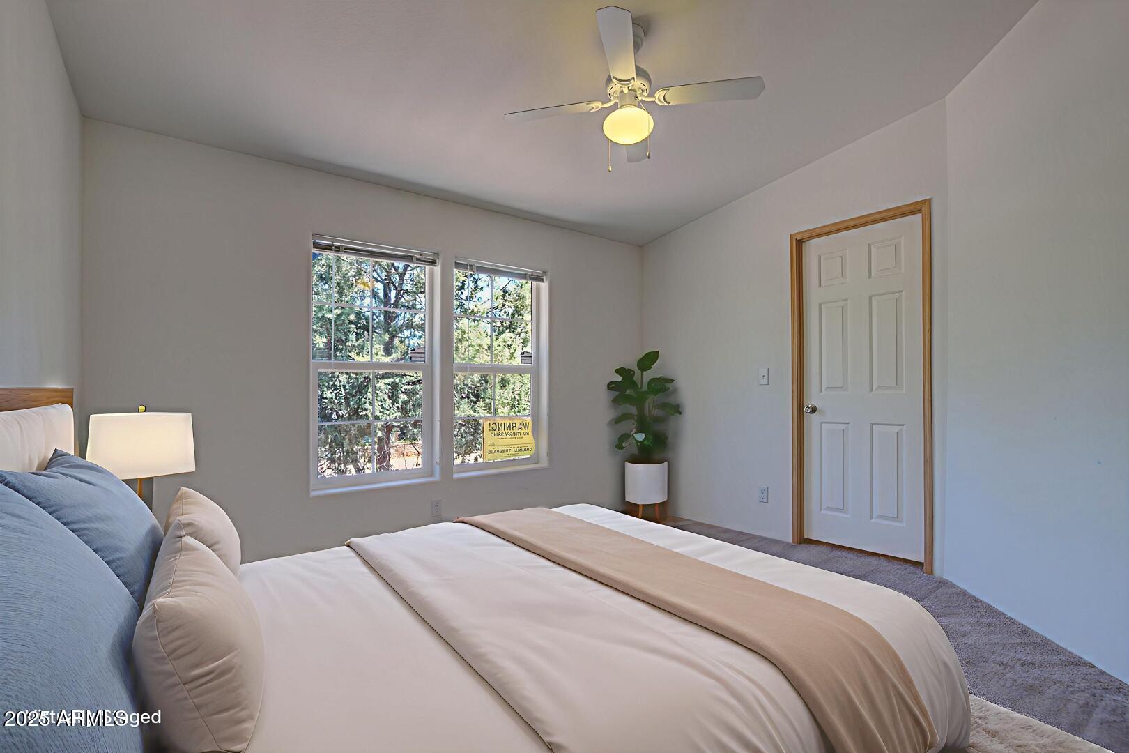 405 East Cherry Street Payson, AZ 85541 - Photo 30 of 47 a bedroom with a bed and a window