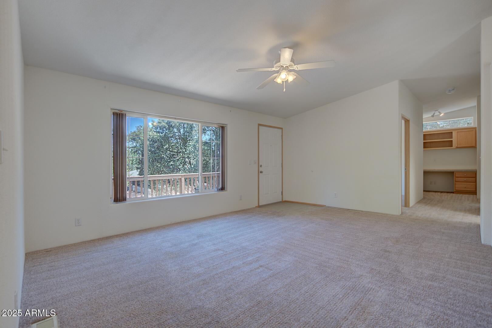 405 East Cherry Street Payson, AZ 85541 - Photo 7 of 47 a view of an empty room with a window