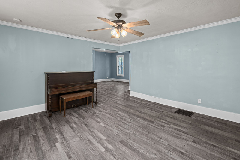 1419 17th Street Moline, IL 61265 - Photo 7 of 28 a view of workspace with wooden floor and a ceiling fan