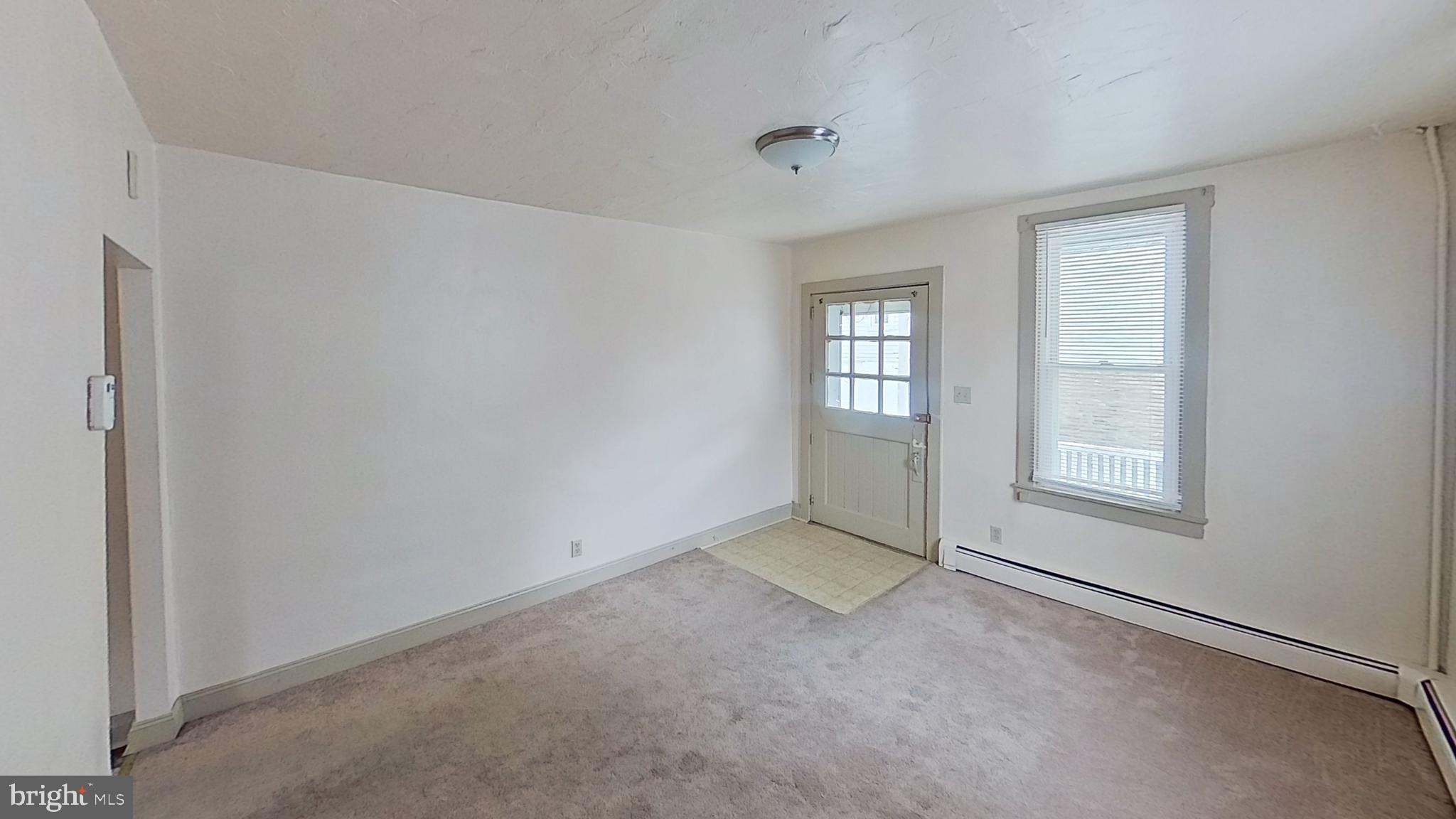 142 West Main Street, Unit C Windsor, PA 17366 - Photo 2 of 8 a view of an empty room with a window