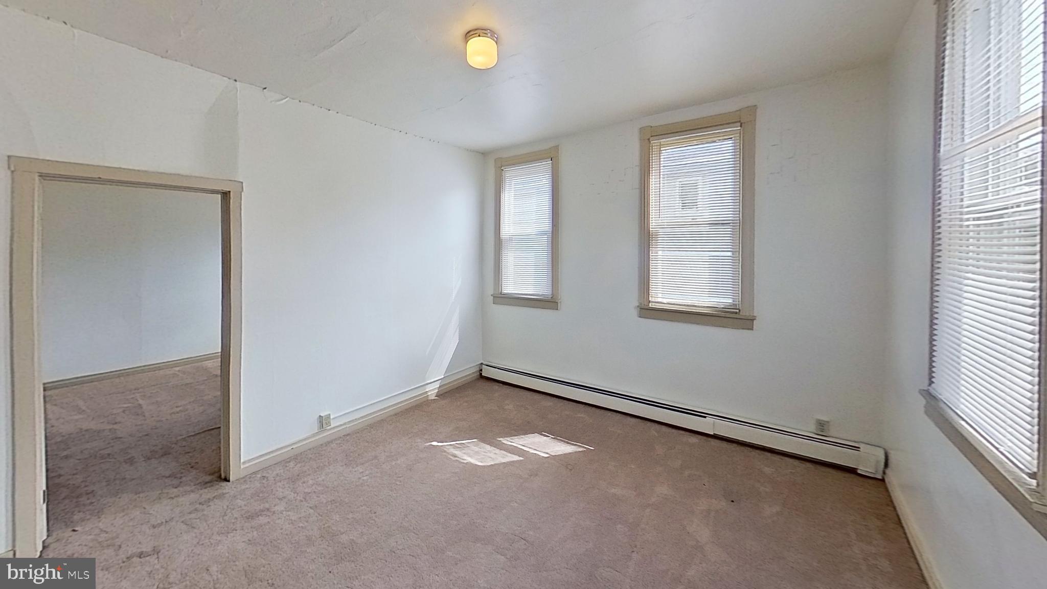 142 West Main Street, Unit C Windsor, PA 17366 - Photo 6 of 8 an empty room with windows