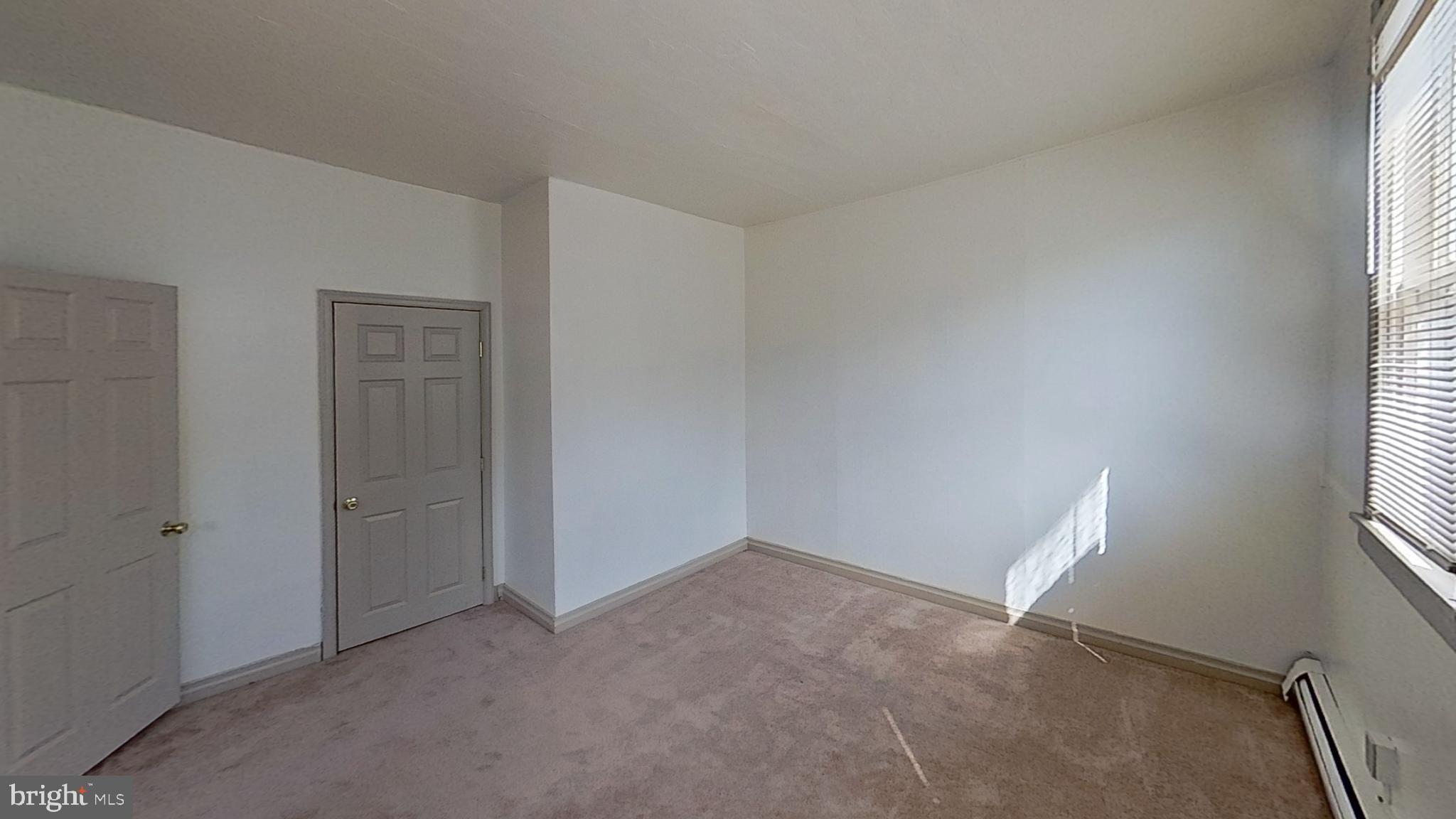 142 West Main Street, Unit C Windsor, PA 17366 - Photo 7 of 8 an empty room with windows