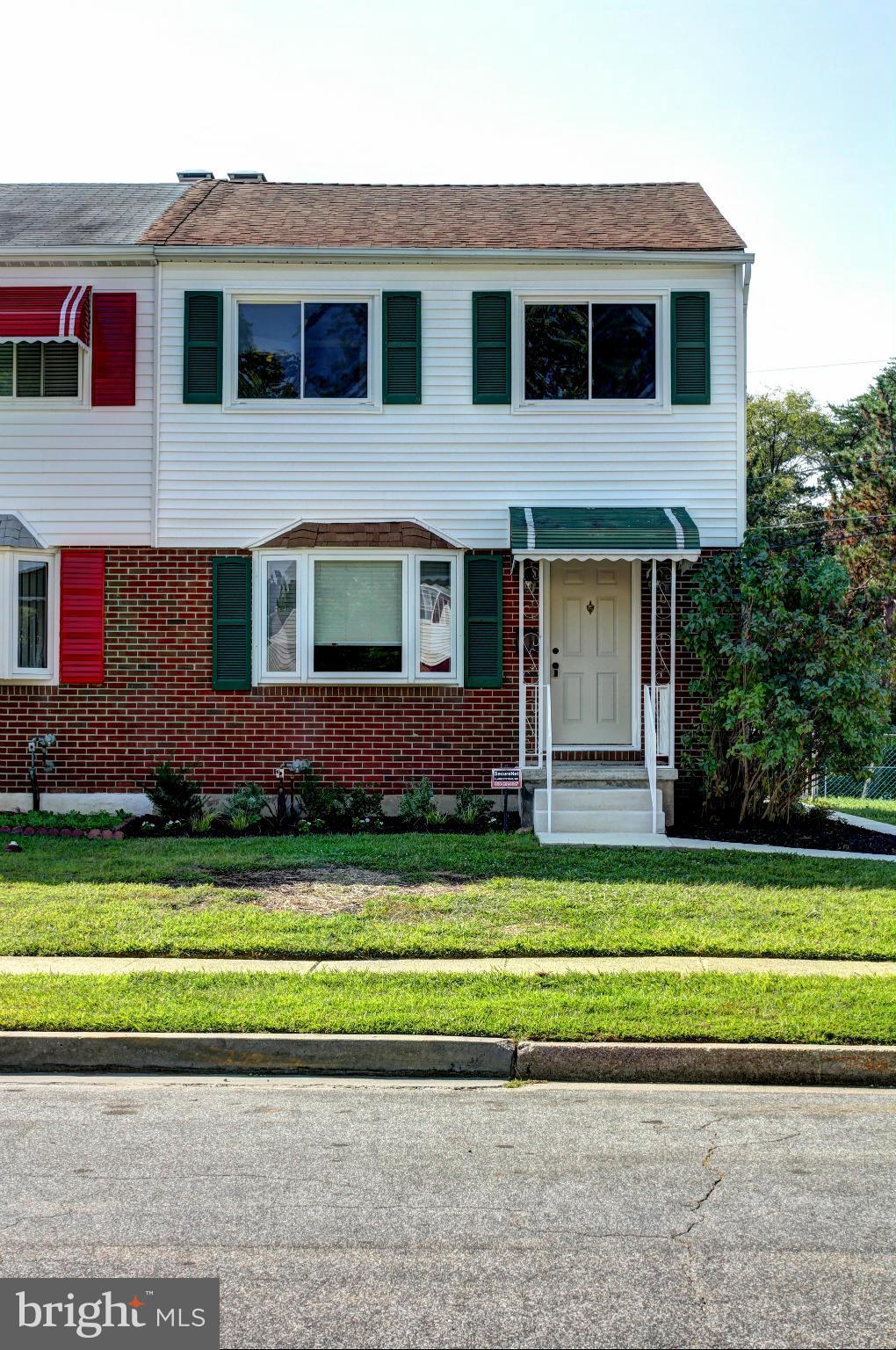 7103 Bexhill Road Baltimore, MD 21244 - Photo 2 of 30 a front view of a house with a yard