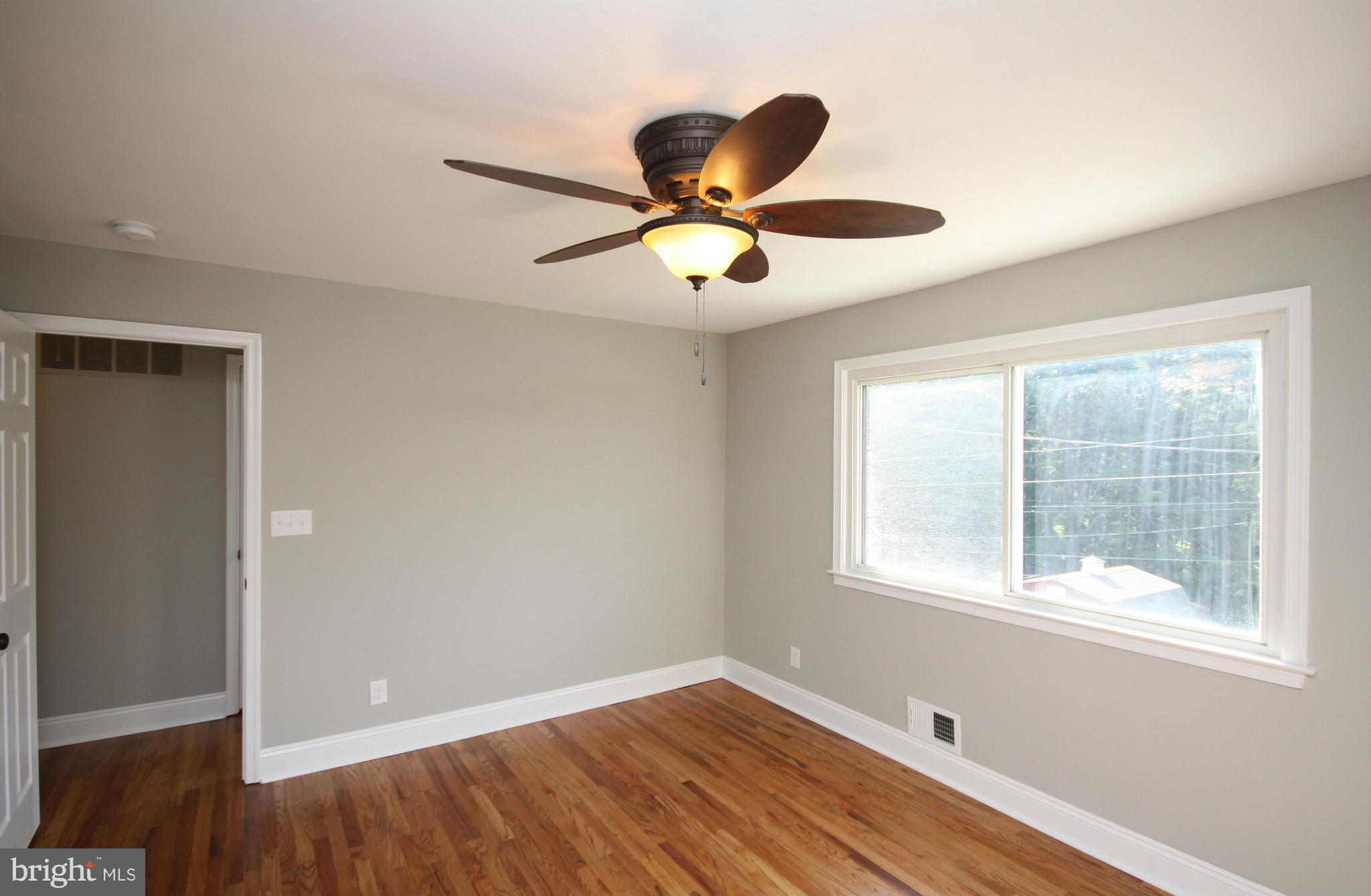 7103 Bexhill Road Baltimore, MD 21244 - Photo 11 of 30 a window in an empty room