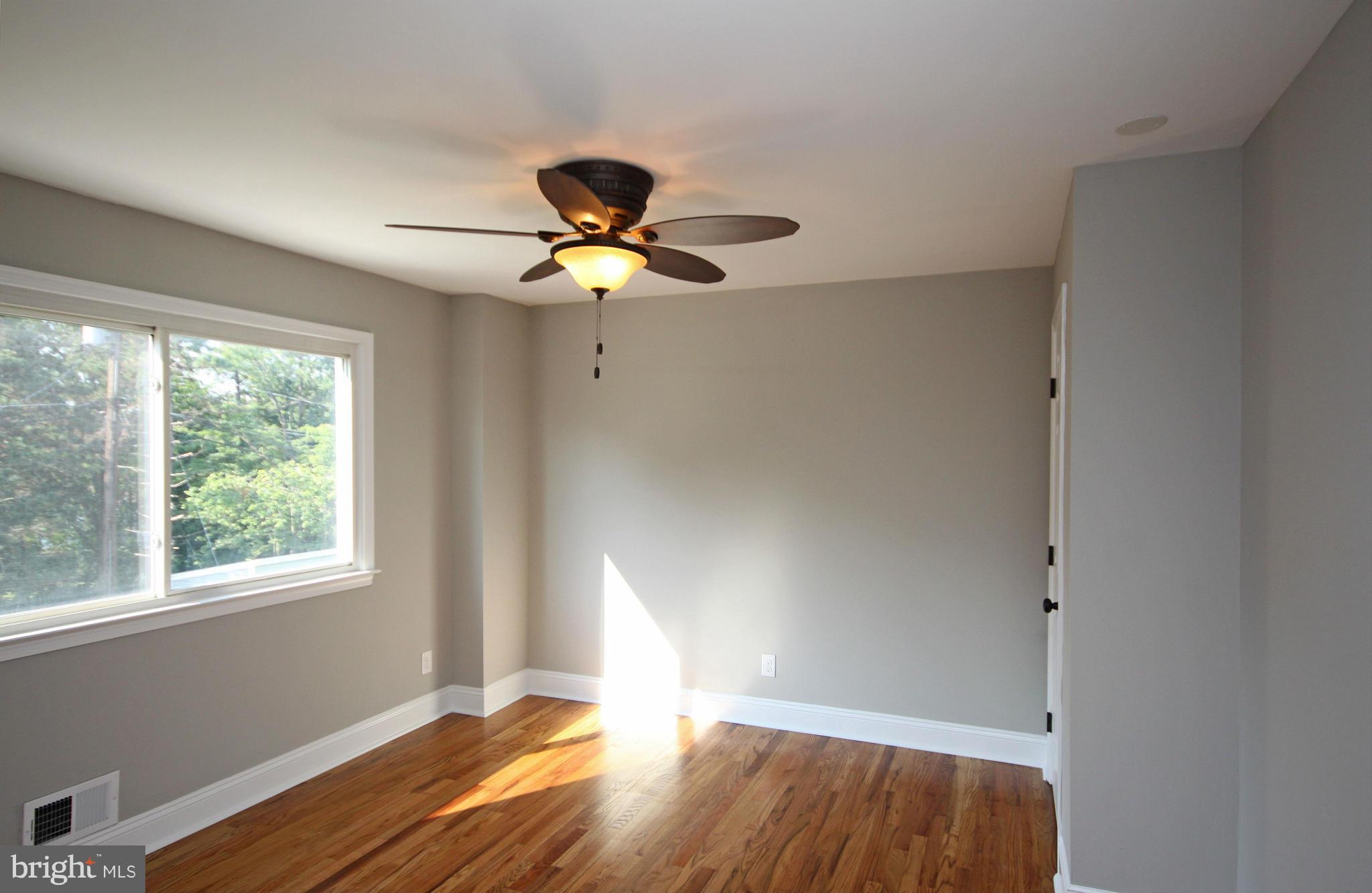 7103 Bexhill Road Baltimore, MD 21244 - Photo 13 of 30 a view of room with a ceiling fan and window