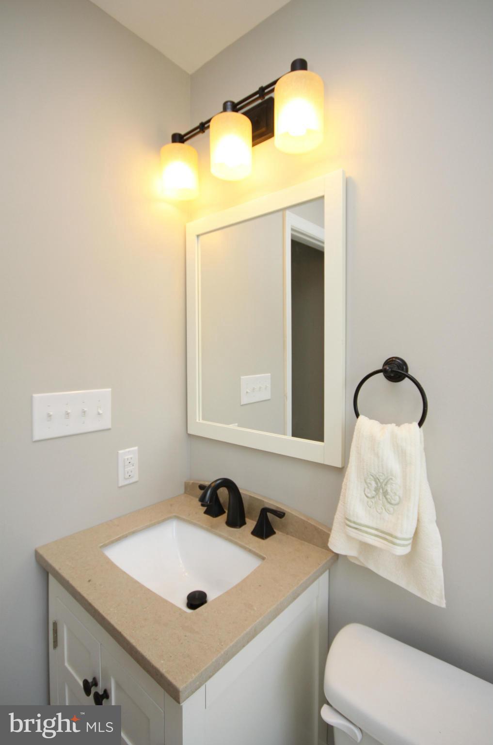 7103 Bexhill Road Baltimore, MD 21244 - Photo 15 of 30 a bathroom with a sink vanity and toilet