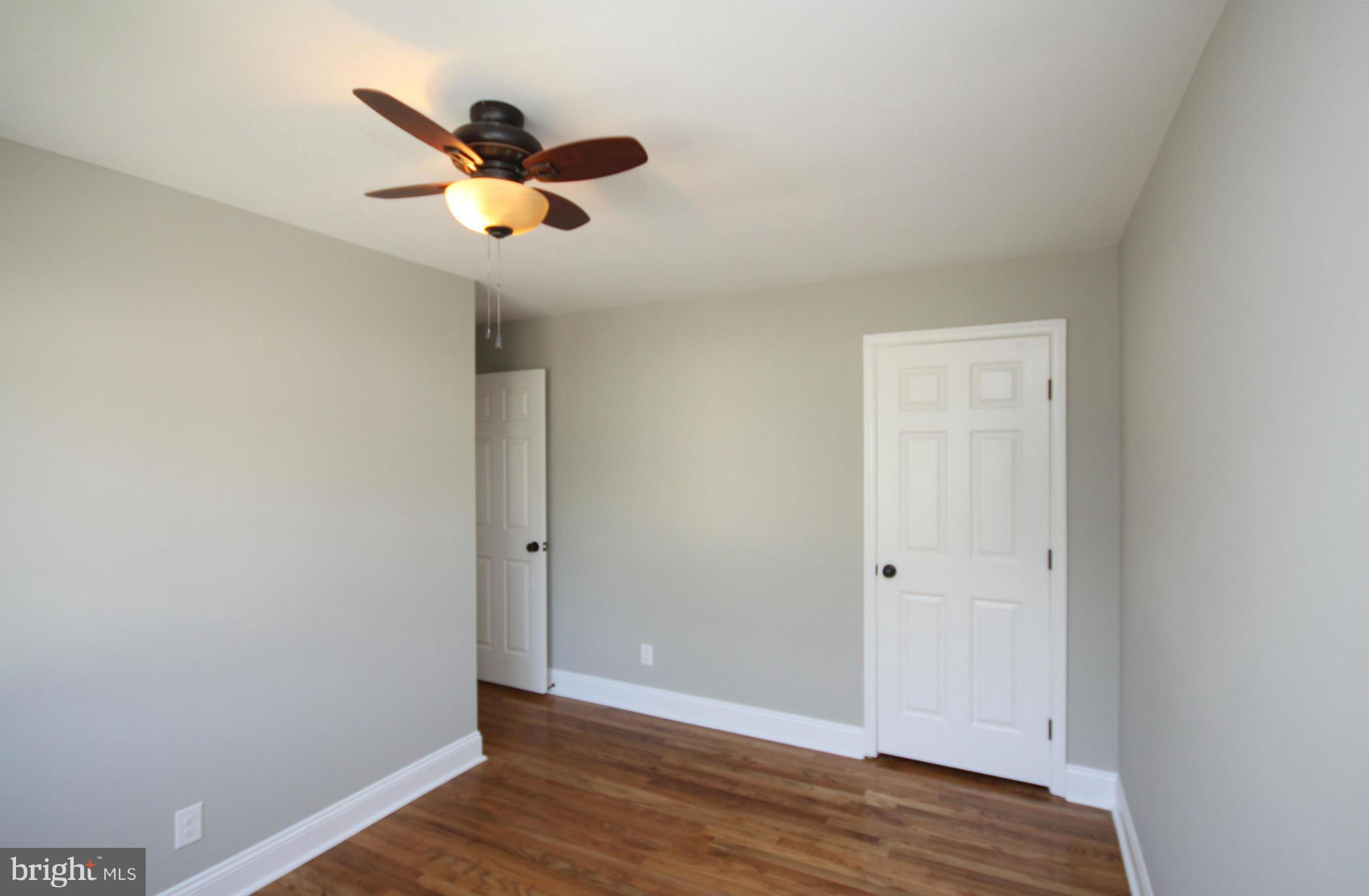 7103 Bexhill Road Baltimore, MD 21244 - Photo 17 of 30 a view of empty room with wooden floor