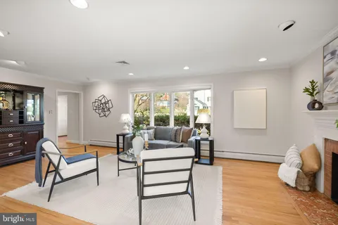 a view of a dining room with furniture wooden floor and chandelier