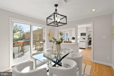 a kitchen with stainless steel appliances a refrigerator and a stove top oven