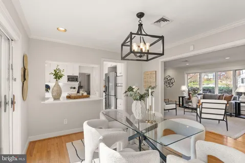 a kitchen with cabinets appliances a sink and a counter top