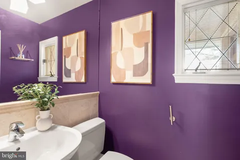 a bathroom with a granite countertop sink a bathtub and a shower