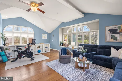 a bedroom with a large bed and a large window