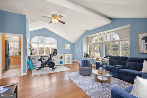 a bedroom with a large bed and a large window
