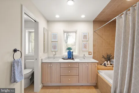 a view of a hallway with wooden floor and entryway