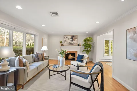 a living room with furniture and a lamp