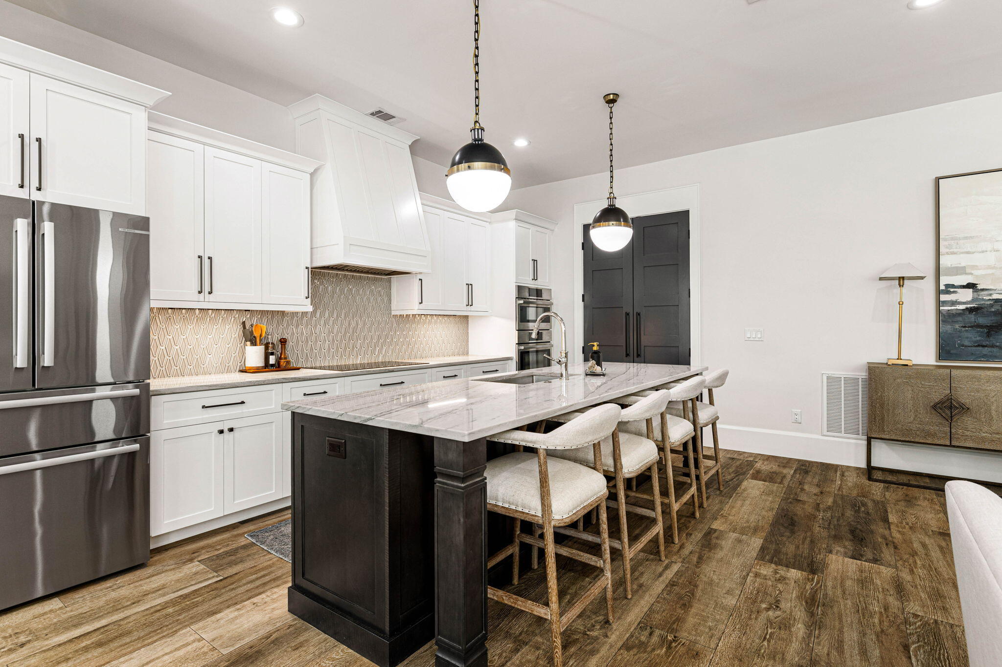 1980 Baytowne Loop Miramar Beach, FL 32550 - Photo 14 of 95 a kitchen with stainless steel appliances granite countertop a stove a sink a refrigerator and a dining table with wooden floor