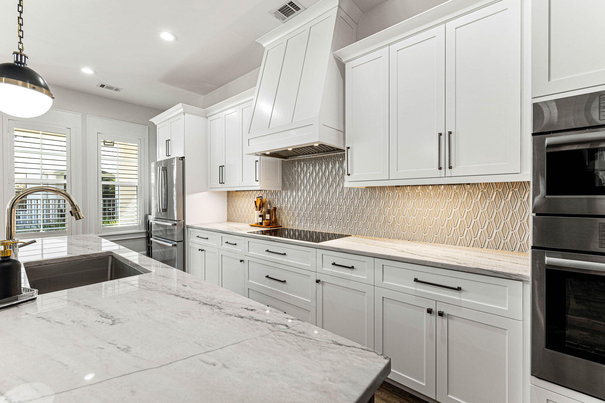 1980 Baytowne Loop Miramar Beach, FL 32550 - Photo 19 of 95 a kitchen with granite countertop white cabinets and white appliances