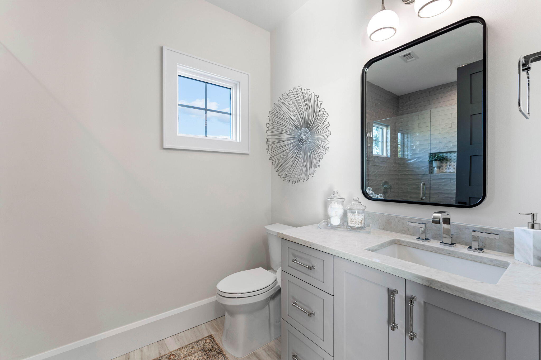 1980 Baytowne Loop Miramar Beach, FL 32550 - Photo 39 of 95 a bathroom with a toilet a sink and mirror