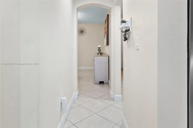 a bathroom with a granite countertop shower and a sink