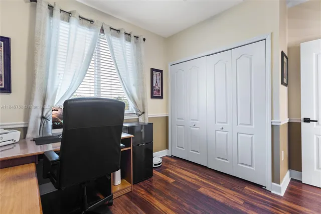 a work room with furniture and wooden floor