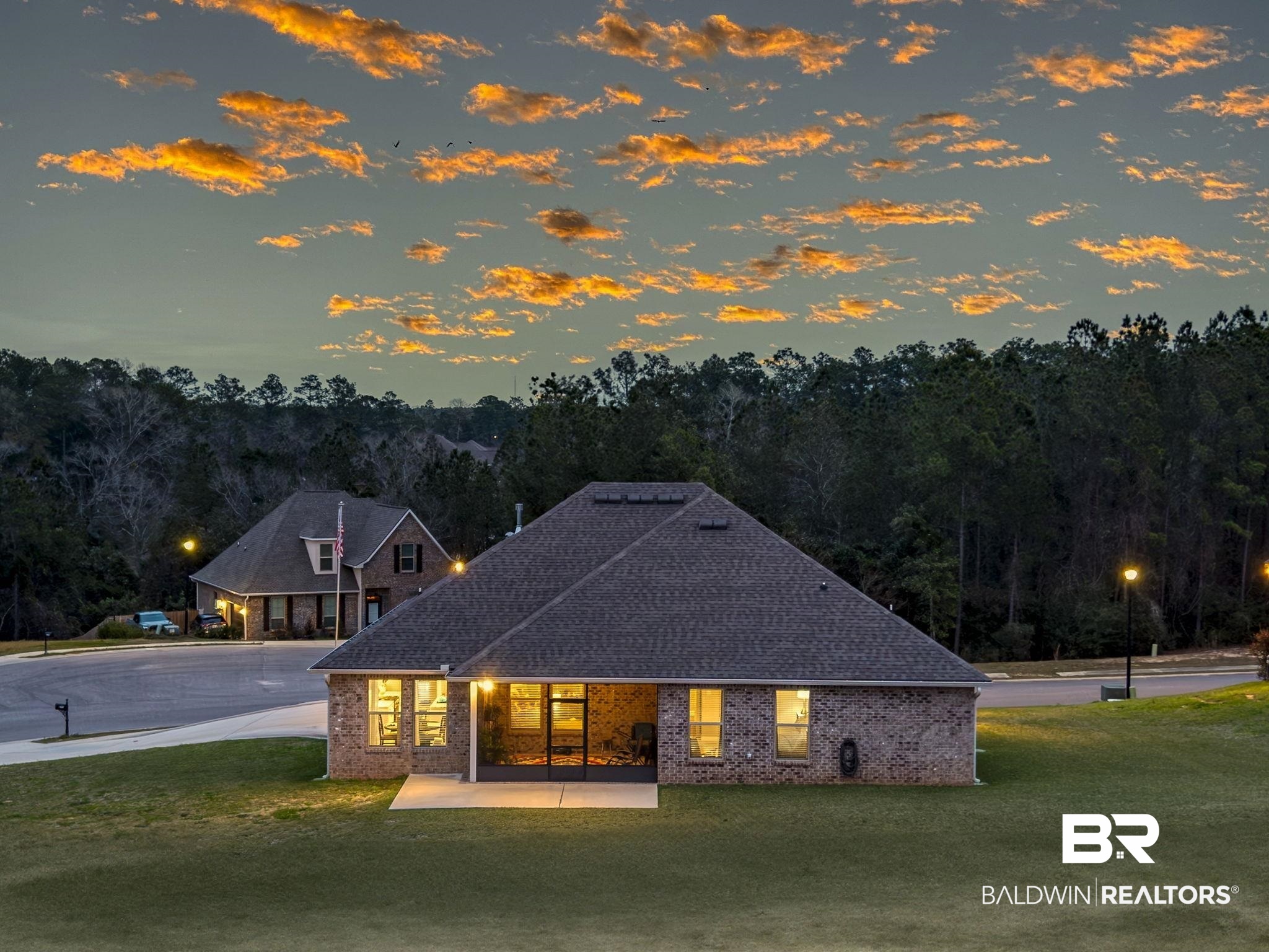 11247 Thistledown Loop Spanish Fort, AL 36527 - Photo 68 of 72 View of front of property featuring brick siding, a patio, and a front yard