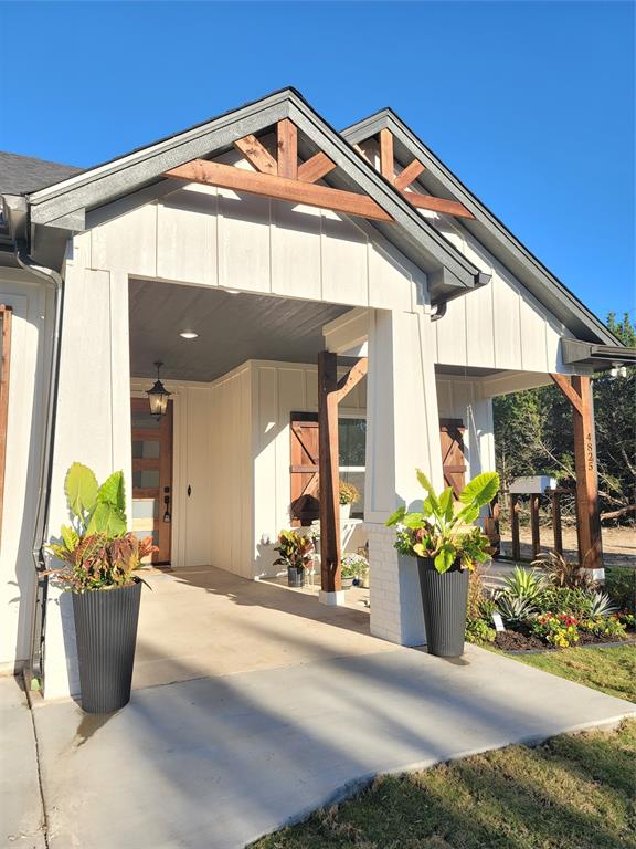 4825 Wichita Street Granbury, TX 76048 - Photo 5 of 30 a view of a house with a potted plant