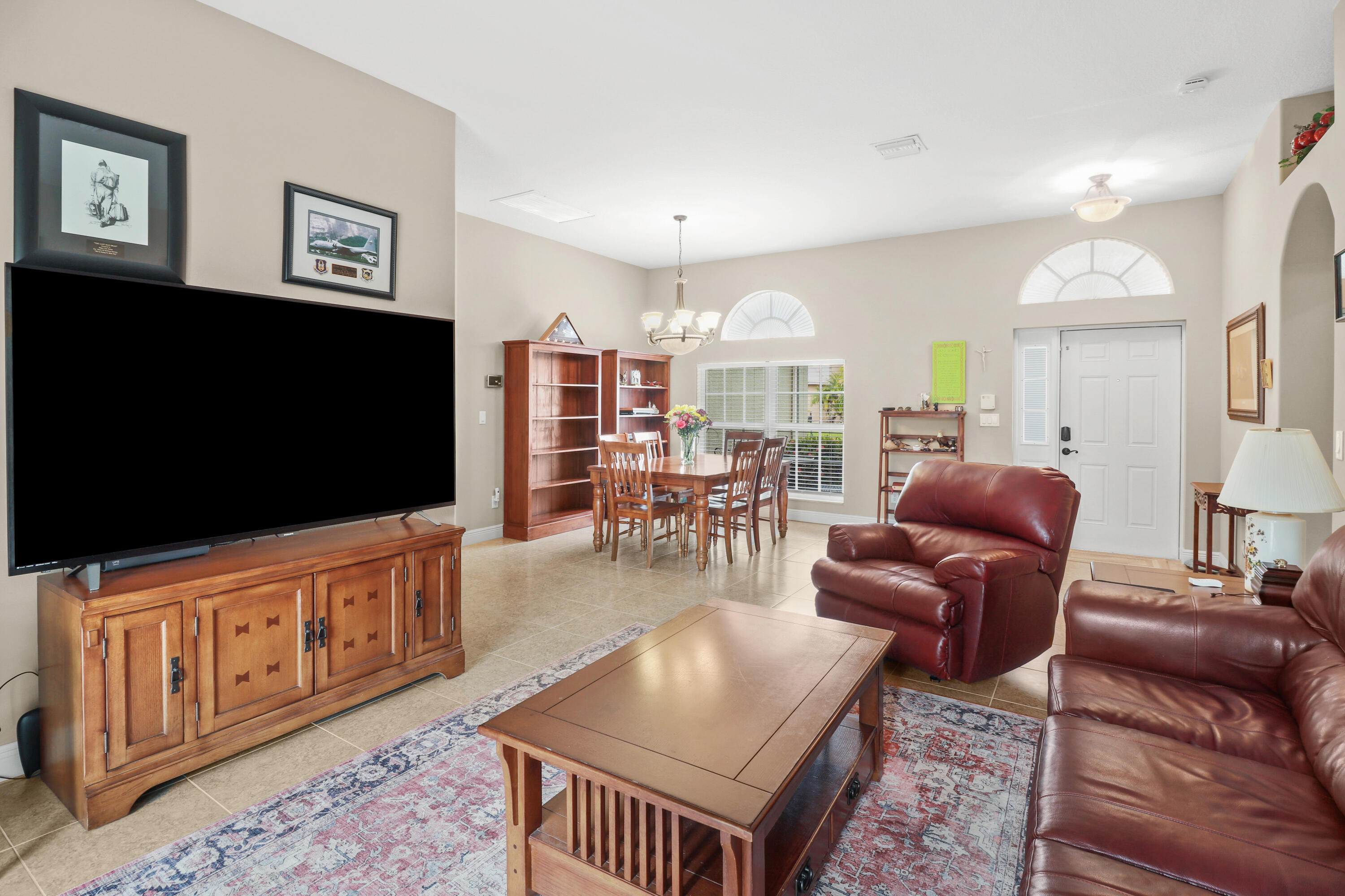 2242 Southwest Panther Trace Stuart, FL 34997 - Photo 13 of 63 a living room with furniture and a flat screen tv
