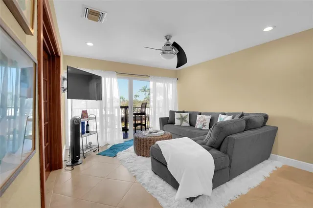 a bedroom with a large bed and a flat screen tv