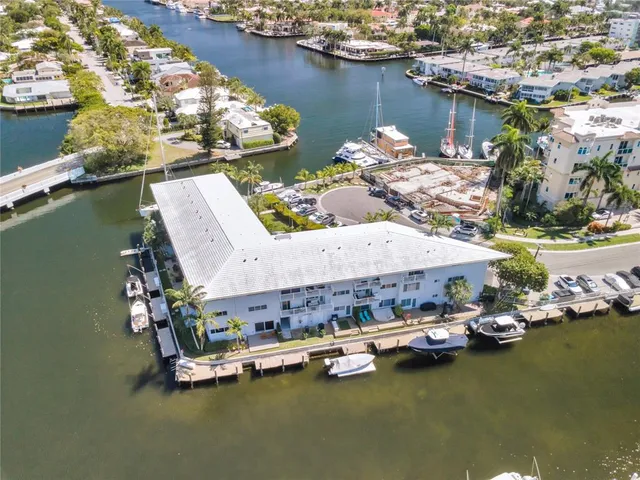 a aerial view of a house with swimming pool and sitting area