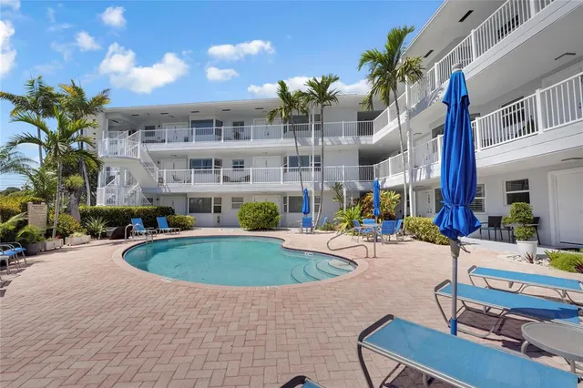 a view of a swimming pool with a patio