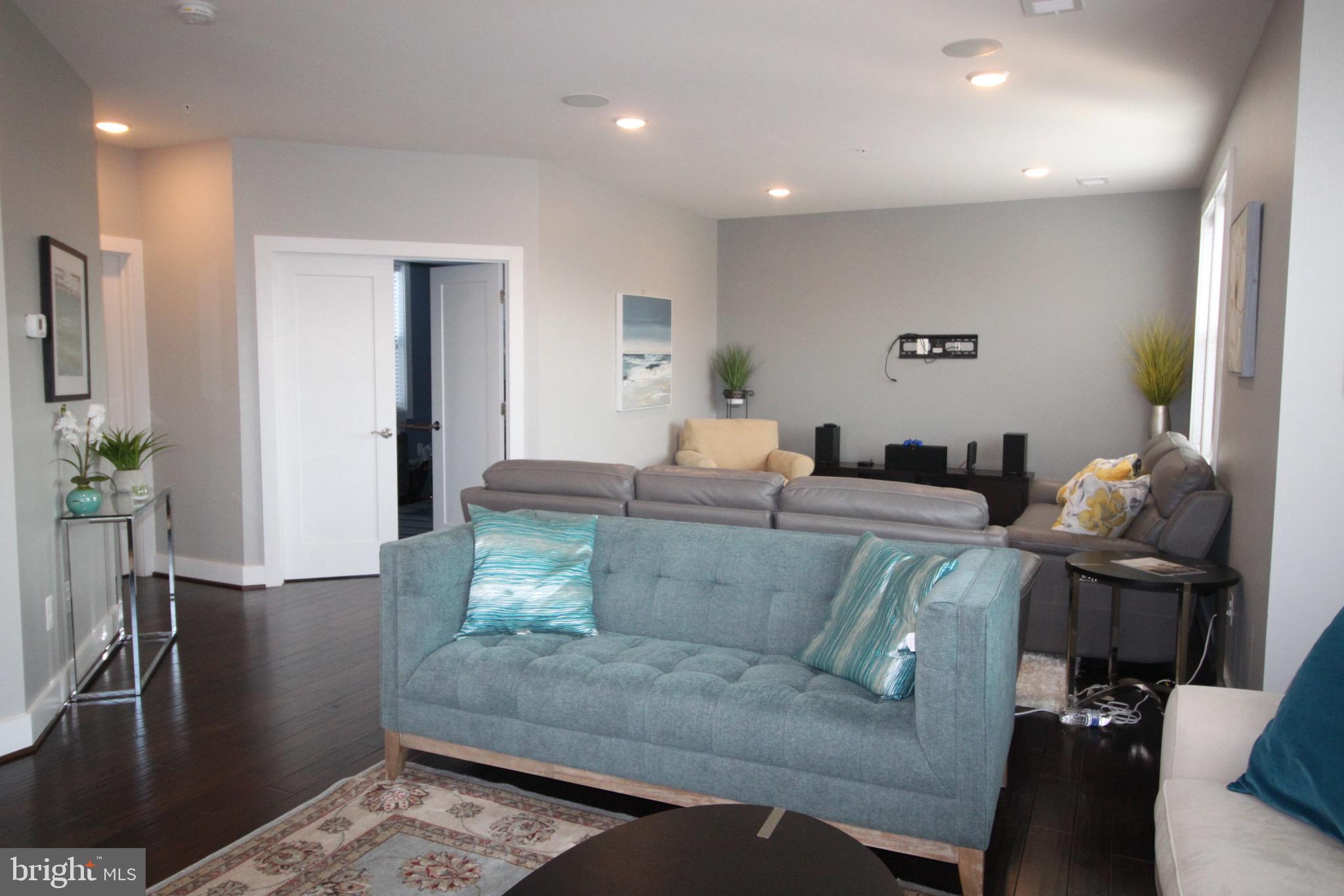 44738 Tiverton Square Ashburn, VA 20147 - Photo 14 of 66 a living room with furniture and wooden floor