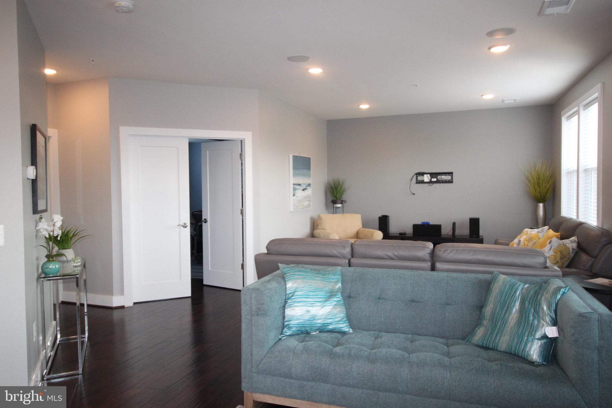 44738 Tiverton Square Ashburn, VA 20147 - Photo 15 of 66 a living room with fireplace furniture and a potted plant