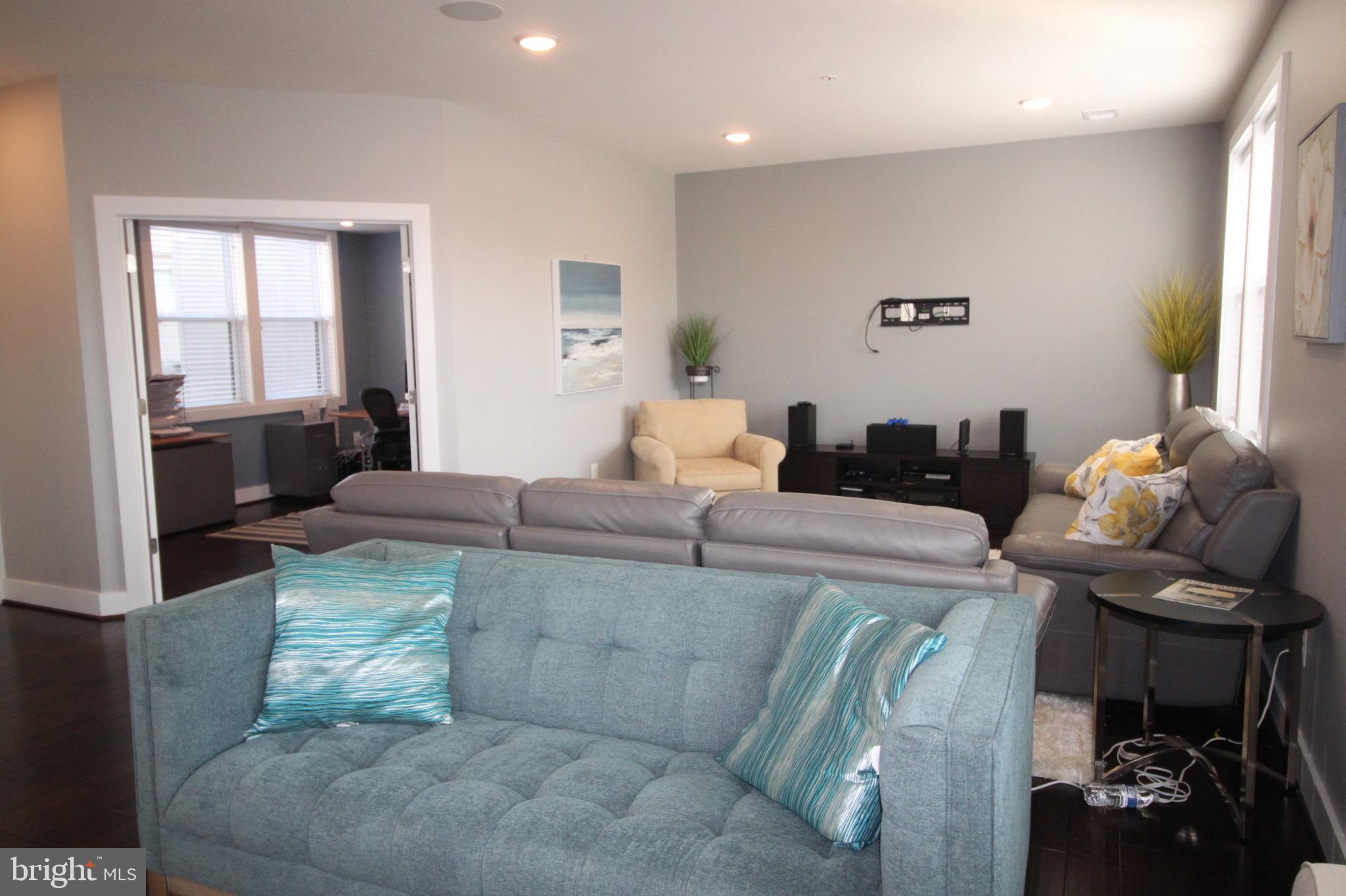 44738 Tiverton Square Ashburn, VA 20147 - Photo 20 of 66 a living room with furniture and a fireplace